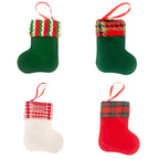 Four colorful fabric stocking ornaments arranged in a decorative row