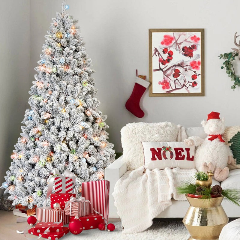 Glowing colored lights illuminating the branches of a flocked Christmas tree