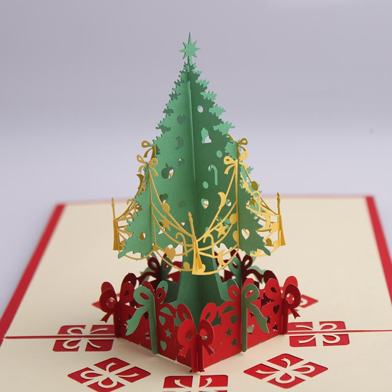Close-up of layered 3D Christmas tree card showing depth and detail