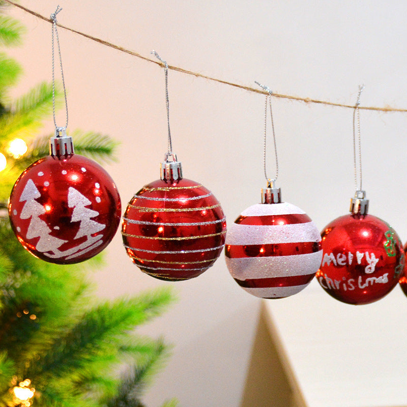 Set of 24 colorful Christmas hanging ball decorations arranged in festive display