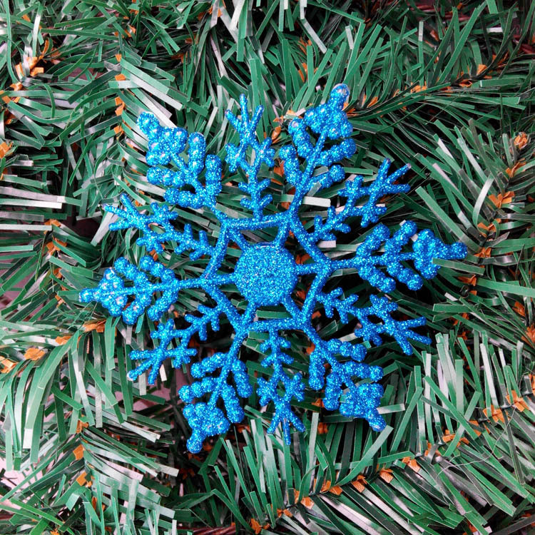Multi-color snowflake hangers arranged as holiday display
