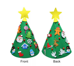 Family hands working together assembling felt Christmas tree craft puzzle