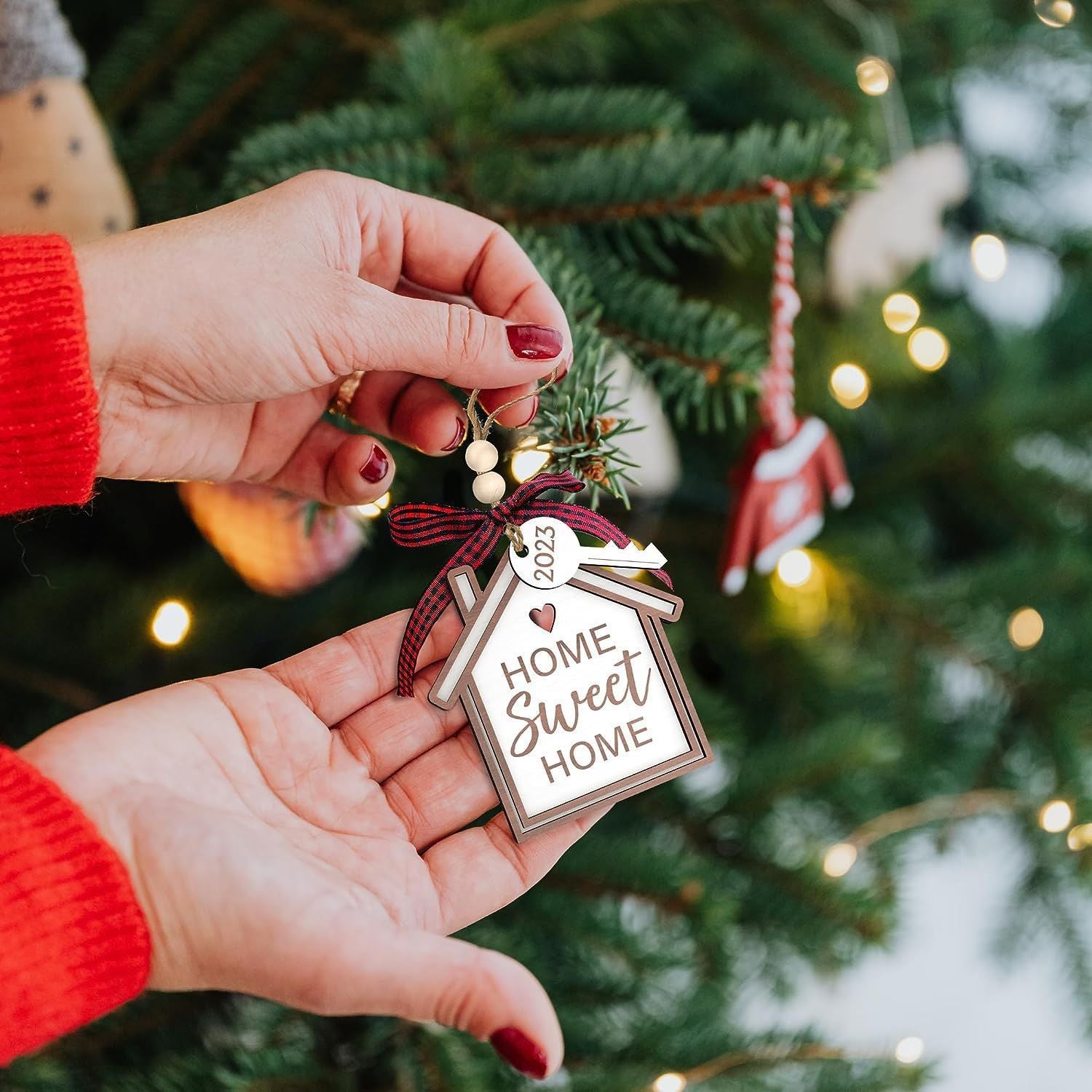 Wooden pendant ornament styled as decorative Christmas house scene
