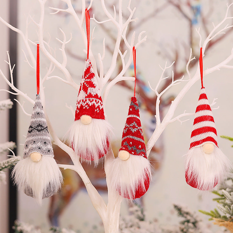 Cozy Christmas forest figure ornament resting on wooden surface with pinecones and berries