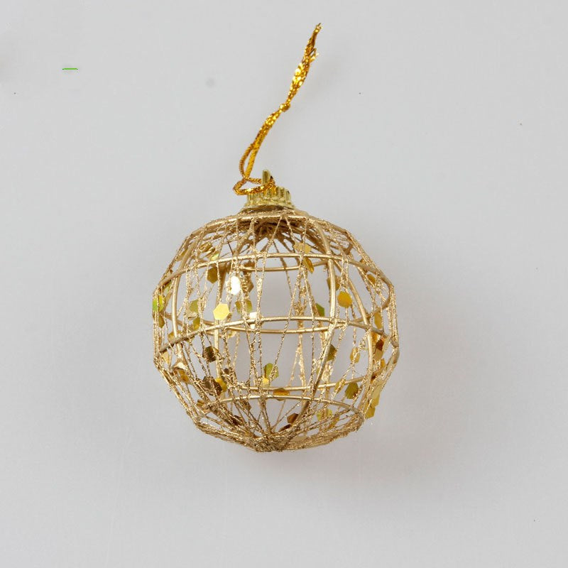 Close-up detail of scaly texture on gold iron Christmas ball ornament for tree decoration