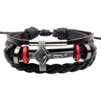 Silver cross pendant on leather bracelet band for devotion