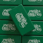 White Christmas cookie tin with green printed holiday design