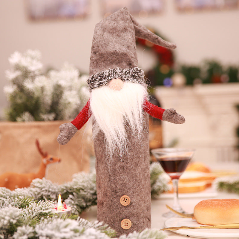 Festive faceless doll bottle cover in green for Christmas decorating
