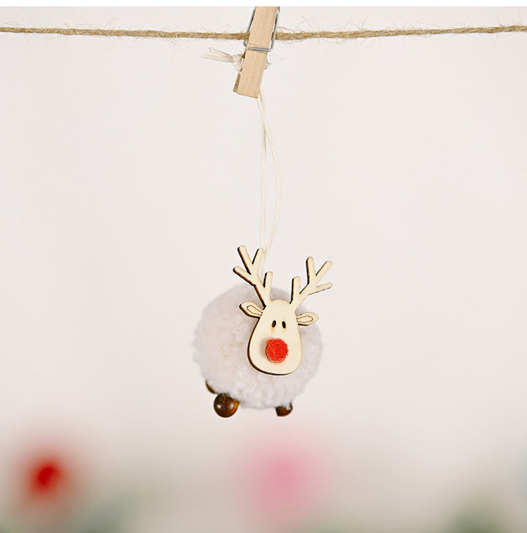 Handcrafted cloth pendant featuring woodland elk and Christmas tree design