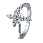 Stacked view of Jesus Cross Rings in multiple sizes from 5 to 10 in silver and gold