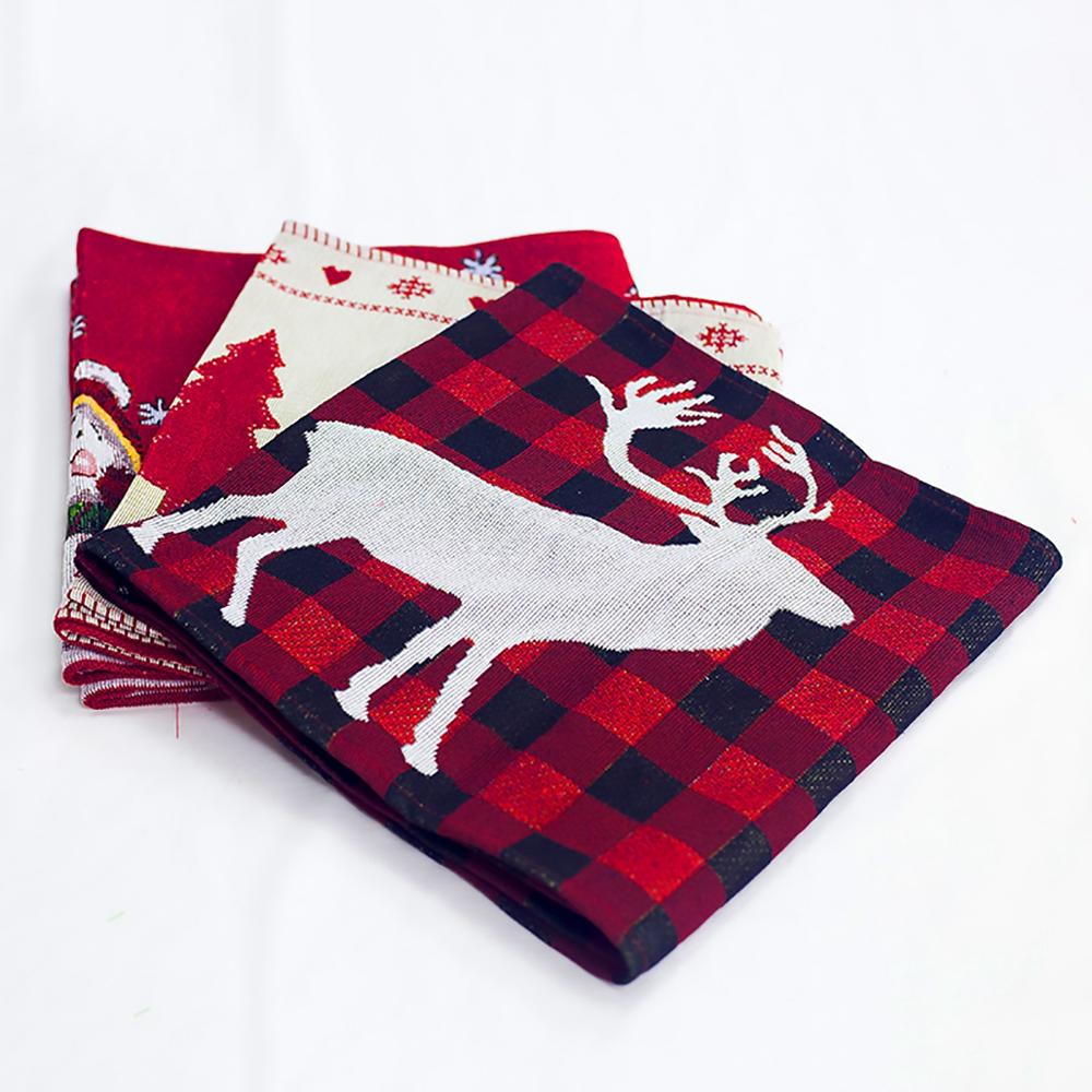 Holiday dining table decorated with Christmas table runner and festive centerpieces