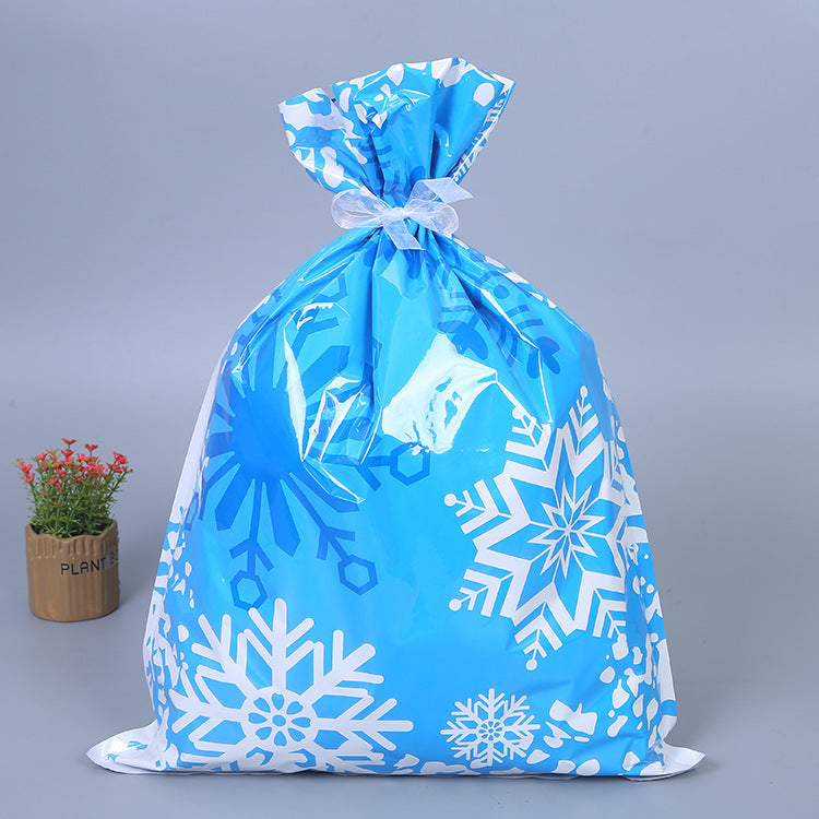 Gold and green Christmas gift bags with decorative bows