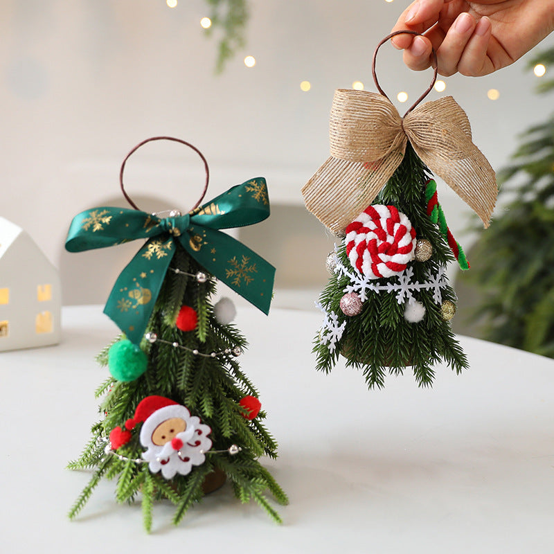 Mini Christmas tree ornament styled on wooden surface