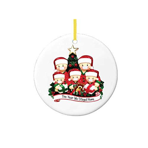 Faith pendant ornament hanging among other Christmas decorations with silver and gold tones