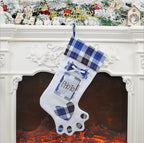 Dog paw Christmas stocking in festive holiday setting