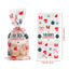 Set of Christmas gift bags with holiday design displayed on wooden surface