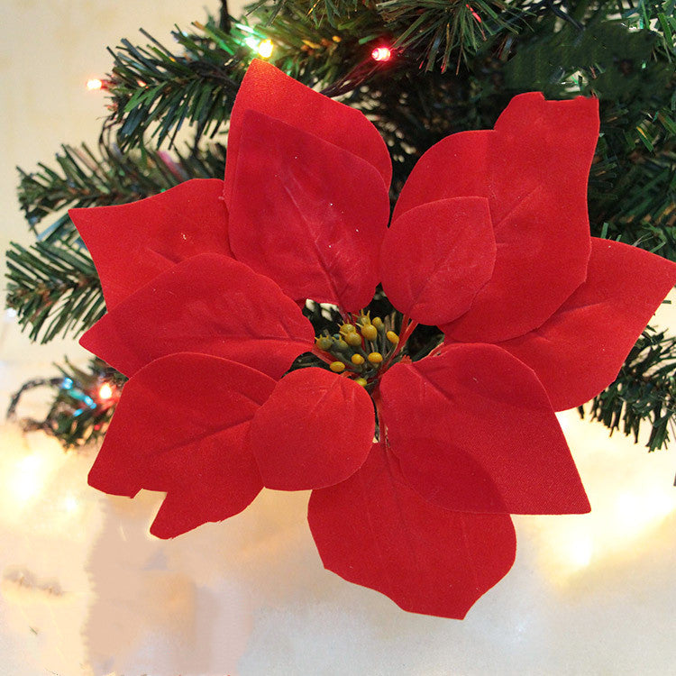 Close-up of white pine cone ornament with soft fabric texture on tree branches