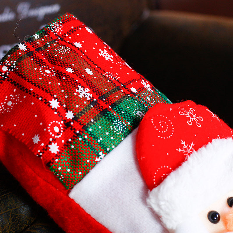 Christmas sock ornaments arranged on fireplace mantel with stockings
