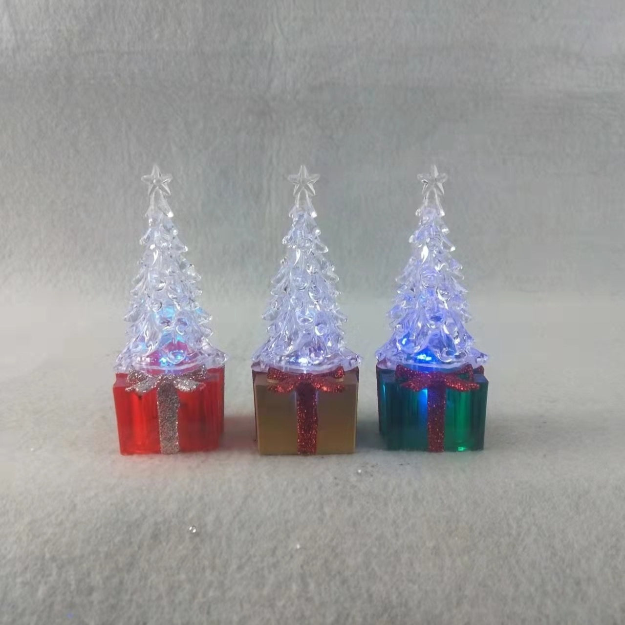 Vibrant red yellow green Christmas tree ornament on festive background Main image