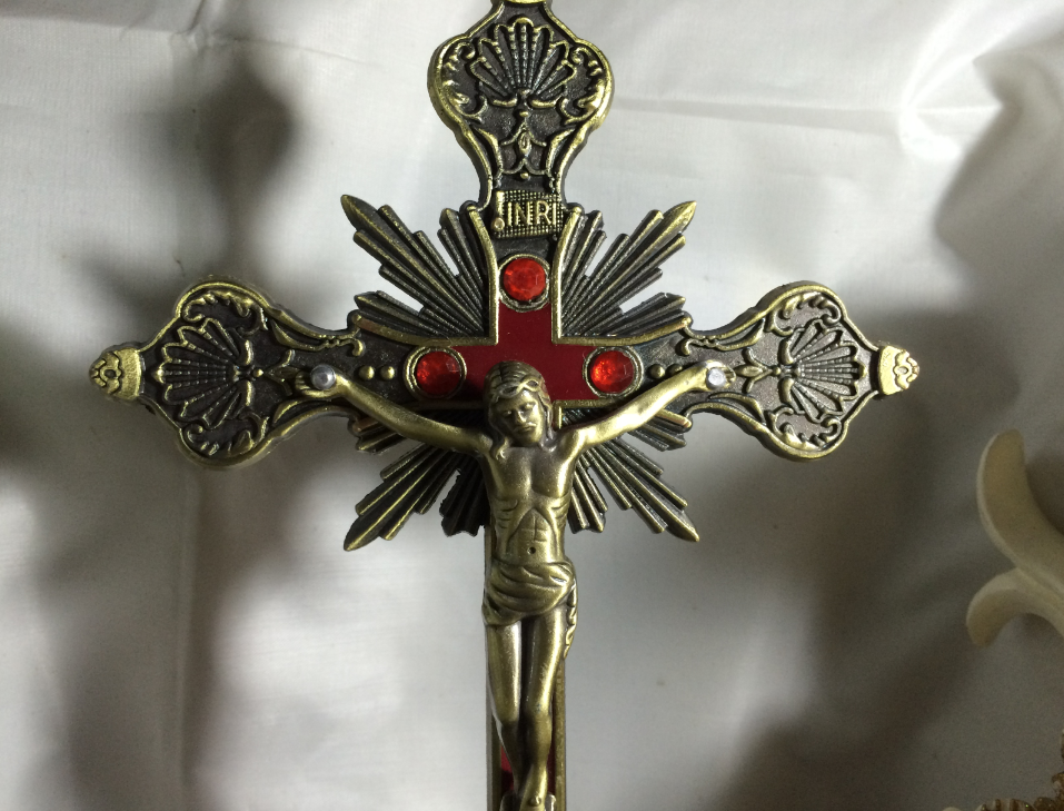 Bronze crucifixion ornament featuring traditional baroque design