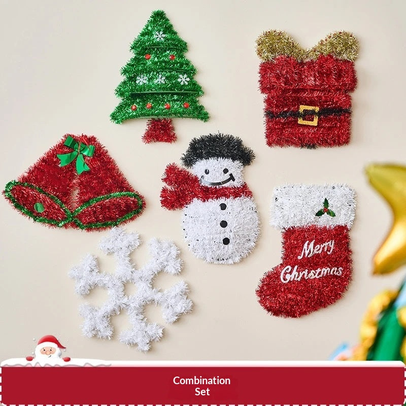 Flat-lay of a brown fabric gingerbread man pendant among Christmas decorations, seasonal ornament