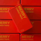Merry Christmas cookie packaging tin with gold lettering on red background