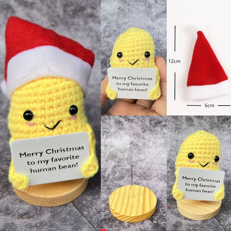 Close-up view of handmade-style plush Christmas gift with yellow and green colors