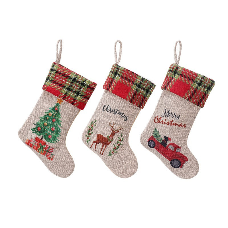 Red and green Christmas stockings arranged on festive background