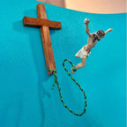 Home decor crucifix with bungee cord on black resin base