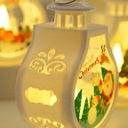 Christmas candle lamp featuring deer design