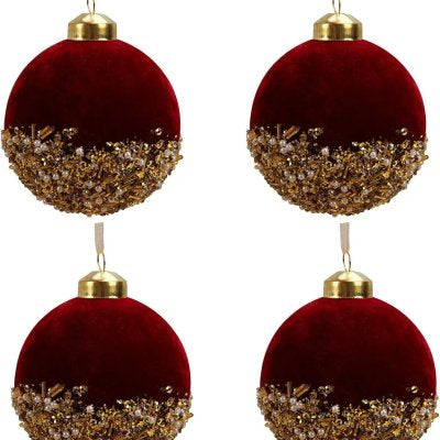 Close-up of burgundy flocked glass ornament with soft focus background