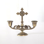 Ornate cross-shaped candle holder in zinc alloy for home prayer spaces