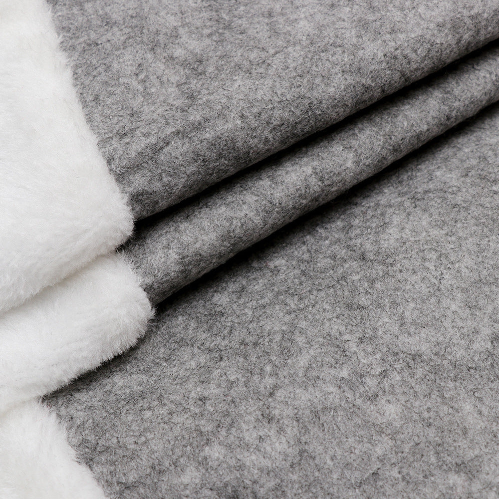 Close-up of elegant gray British leaf design on Christmas tree skirt
