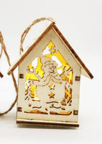 Small wooden house Christmas decorations displayed on Christmas tree branches