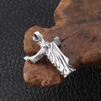 Close-up detail showing vintage distressed texture on sterling silver Jesus pendant