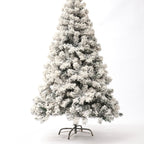 Close-up of PVC flocked branches creating snow effect on Christmas tree
