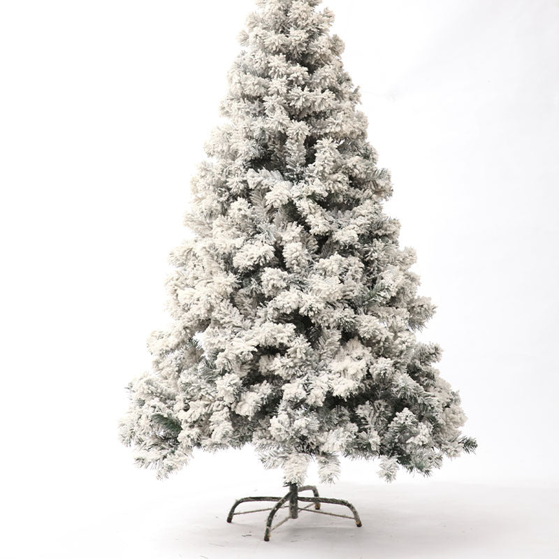Close-up of PVC flocked branches creating snow effect on Christmas tree