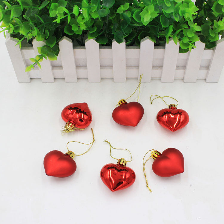 Pink peach heart Christmas pendant against holiday backdrop with warm lighting and faith inspiration
