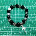 Unisex Saint Benedict rosary bracelet on wrist demonstrating comfortable fit and casual style