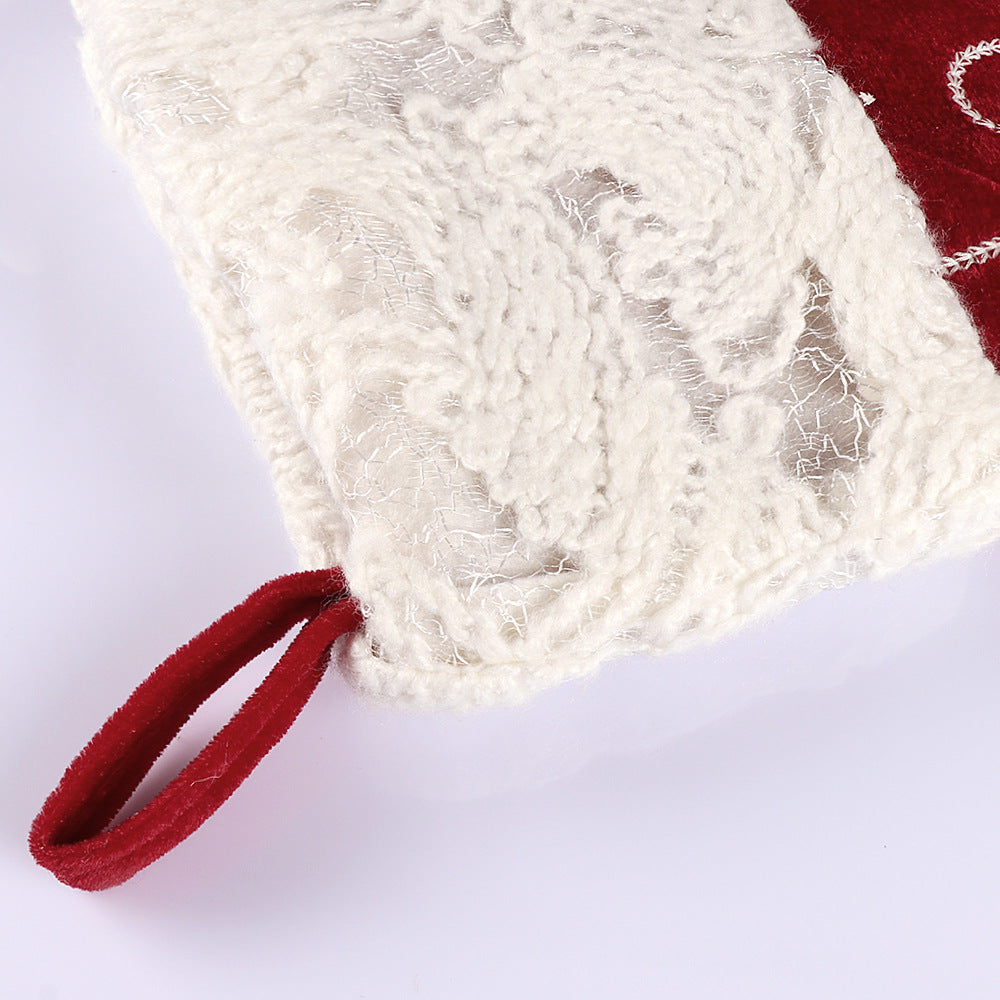 Christmas sock pendant featuring intricate snowflake embroidery in rich velvet