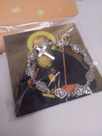 Side profile view of adjustable rose bead bracelet with religious pendants