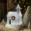 Eve Luminous Crystal House Christmas Decoration glowing warmly in festive setting