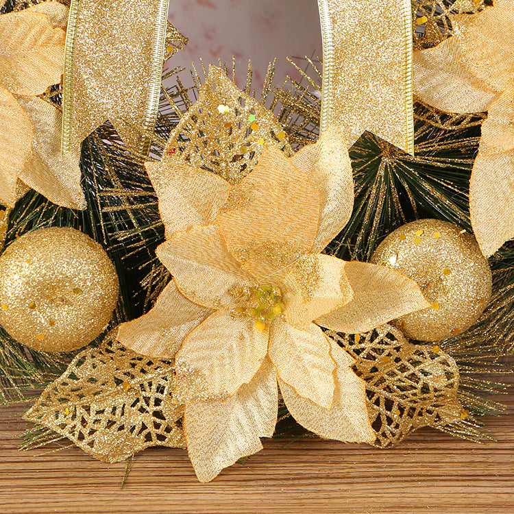 Natural pine needle Christmas wreath ornament with festive decorative detail