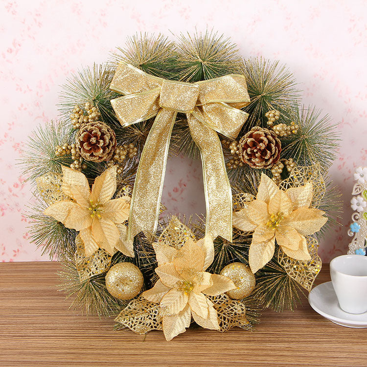 Close-up of rustic pine needle wreath ornament hanging on Christmas tree