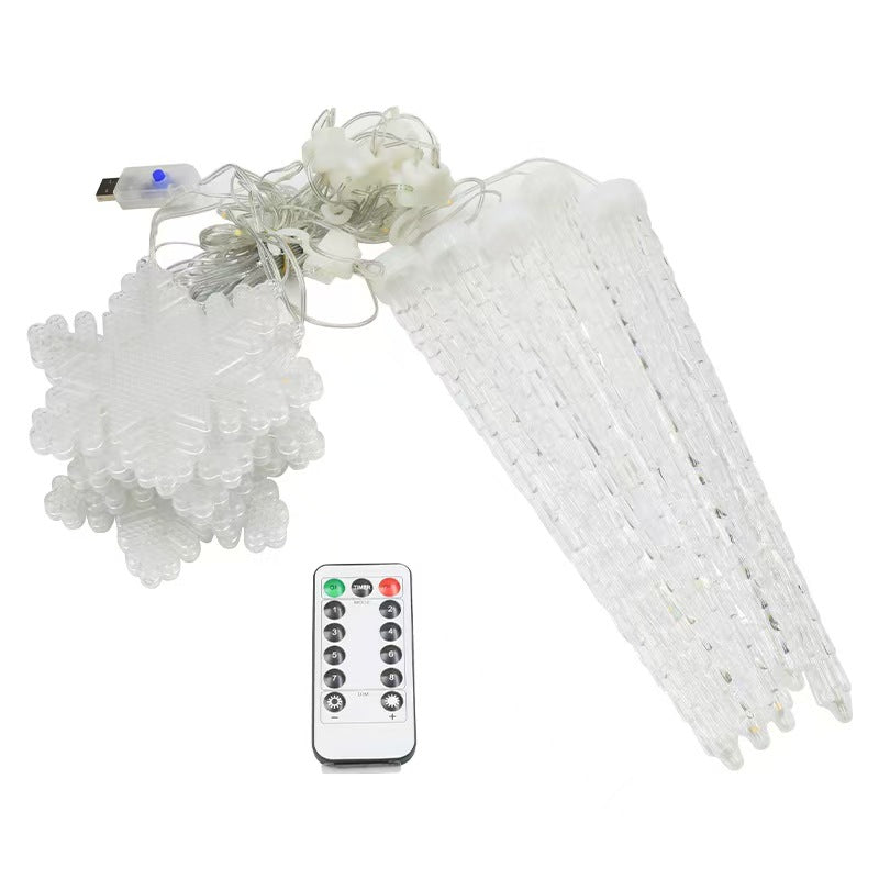 Warm white snowflake decorative lights arranged on dark background
