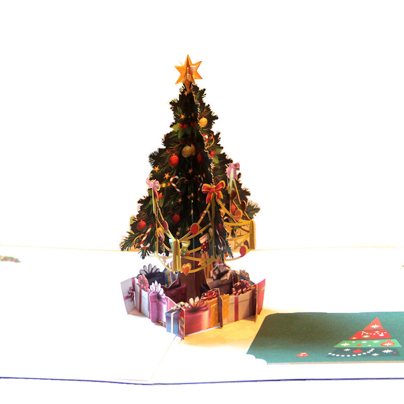 Festive fold card displaying Christmas tree artwork with warm tones