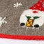 Christmas tree apron with Nordic elders pattern draped around tree base in cozy living room