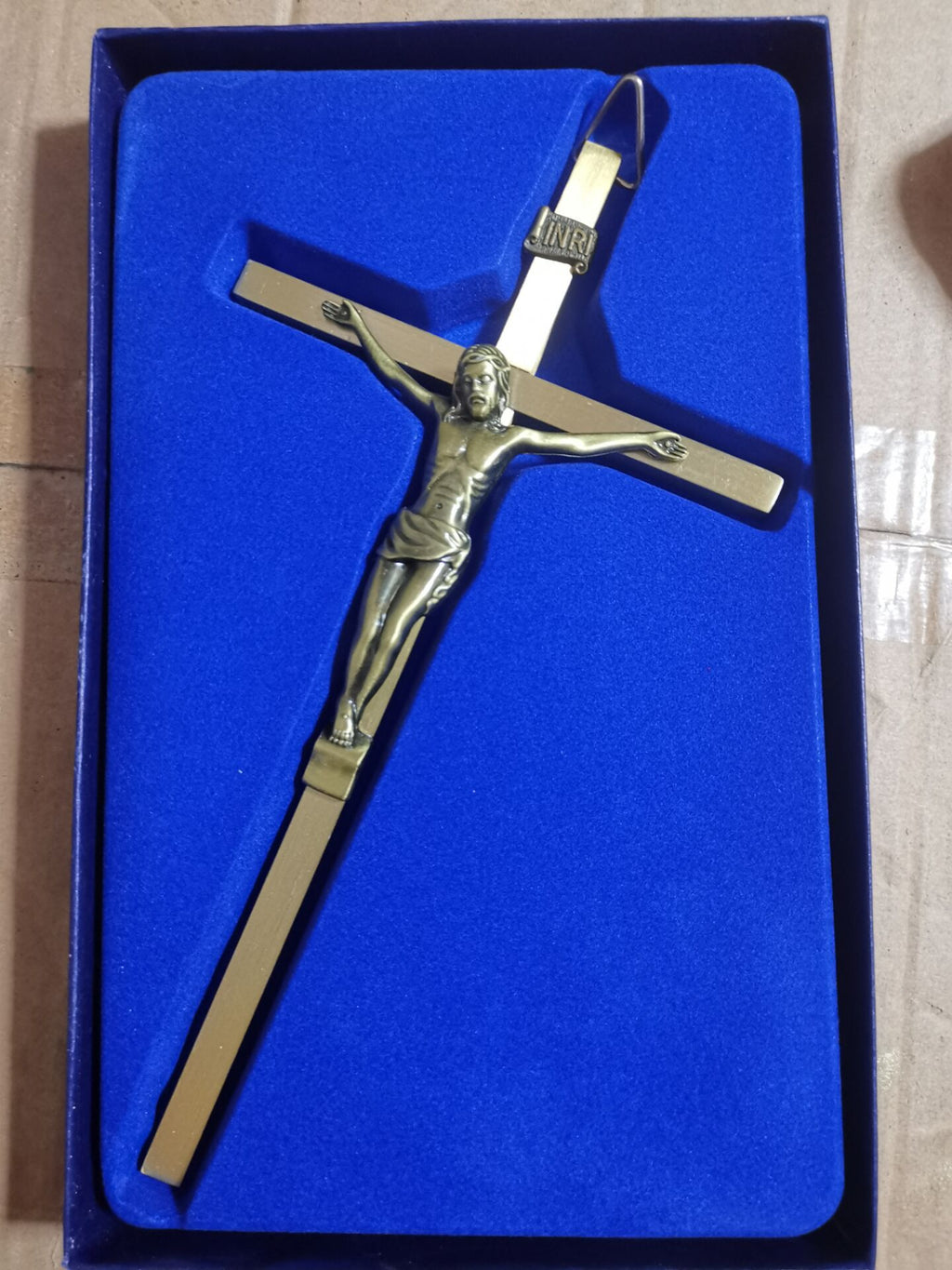 Jesus crucifix pendant with bronze-tone finish on white background - Christian Jewelry