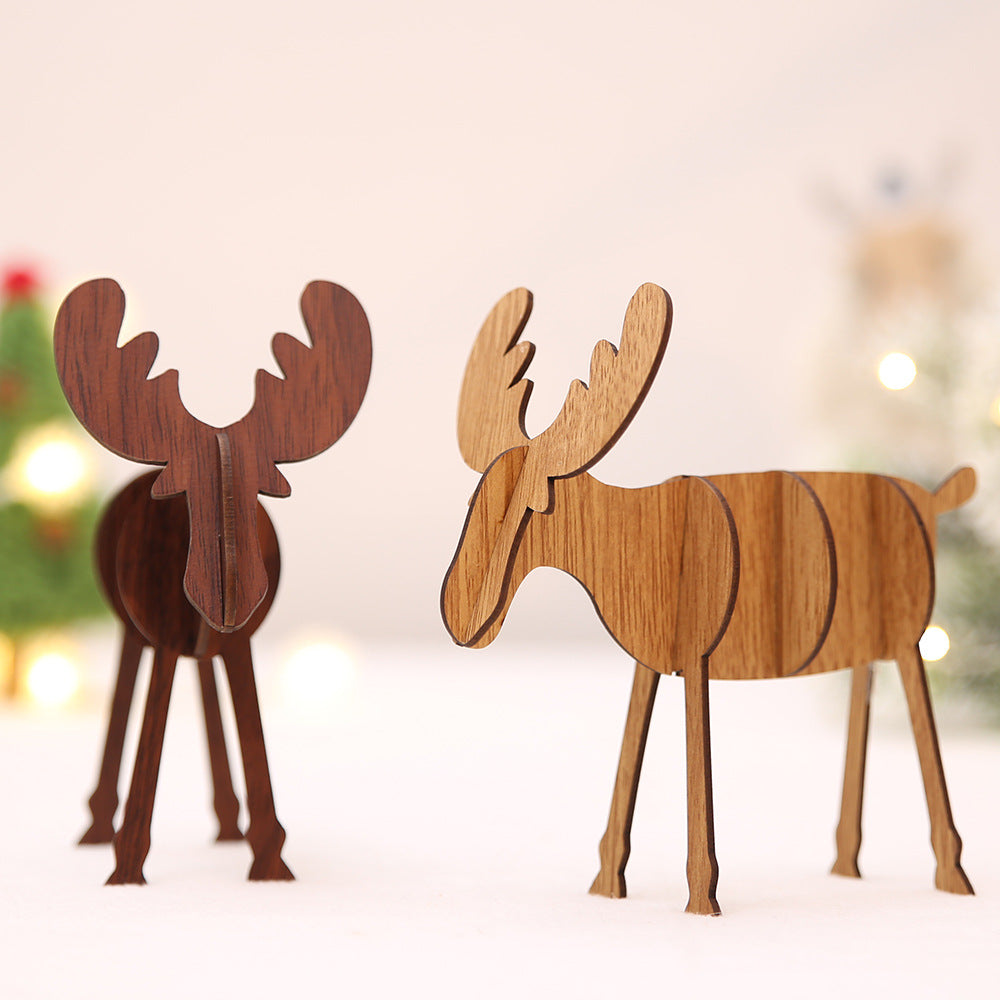 Elegant wooden elk ornament with gold accents on a decorated Christmas tree