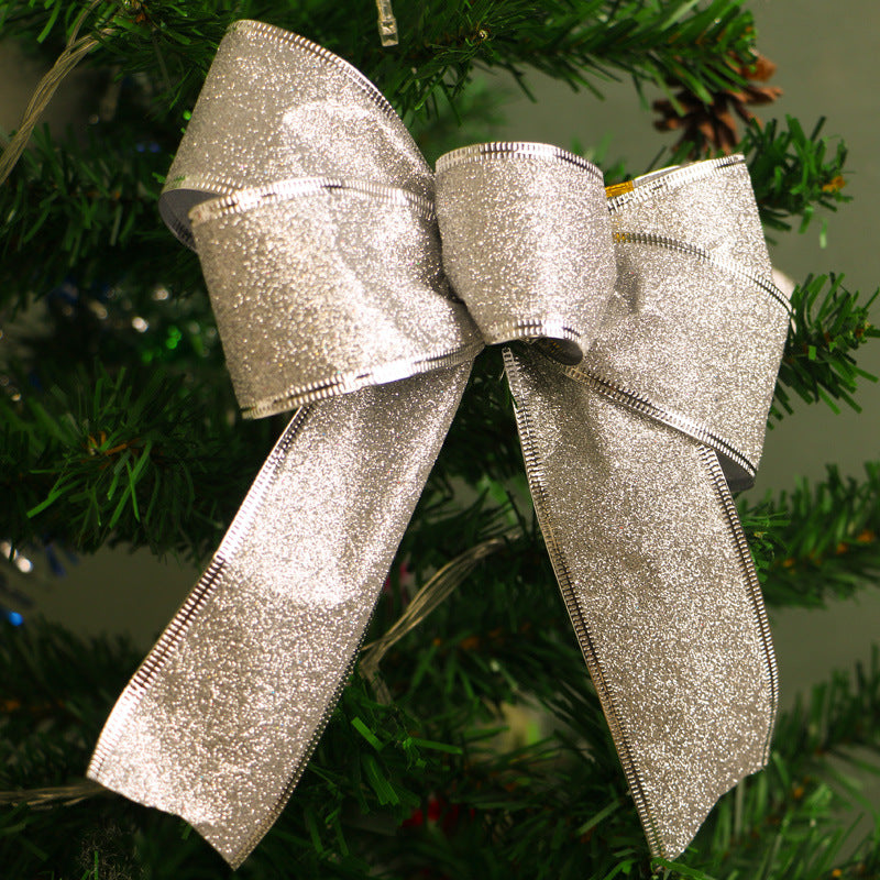 Shimmering Christmas glitter bow in red and gold colors for holiday tree